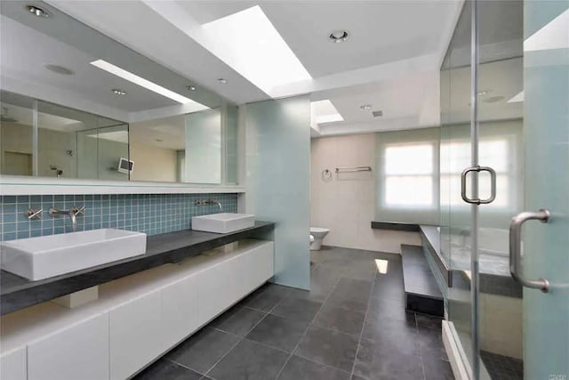 333 Baltustrol Cir, Roslyn, NY 11576 - bathroom with decorative backsplash, a stall shower, and toilet