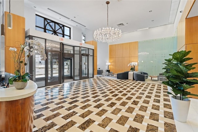 community lobby featuring a towering ceiling