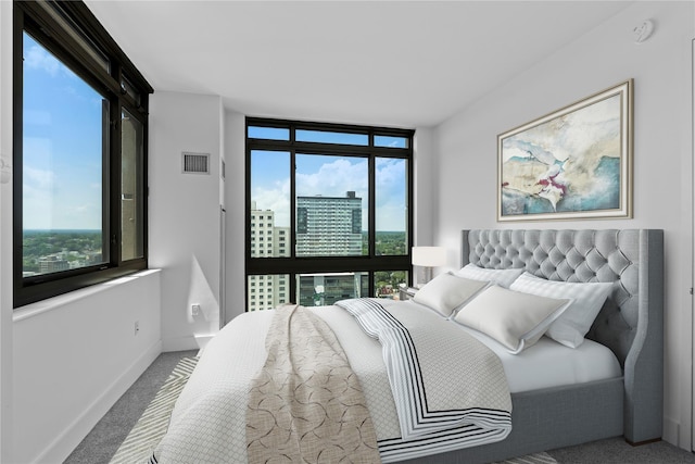 175 Huguenot St Unit 1808, New Rochelle, NY 10801 - carpeted bedroom featuring a view of city and a wall of windows