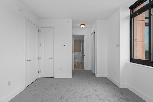 175 Huguenot St Unit 1808, New Rochelle, NY 10801 - unfurnished bedroom featuring carpet floors and multiple windows