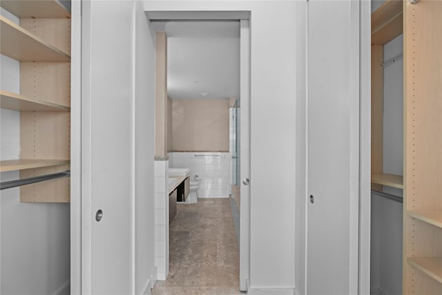 175 Huguenot St Unit 1808, New Rochelle, NY 10801 - hall featuring wainscoting and tile walls