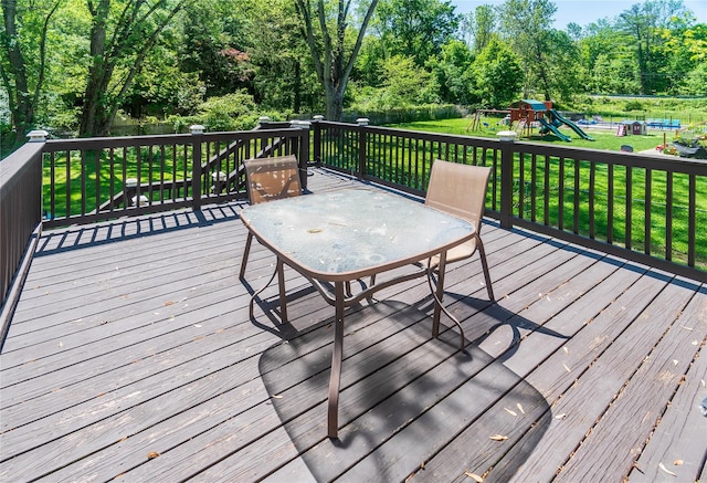 184 Cedar Valley Rd, Poughkeepsie, NY 12603 - deck with outdoor dining area, a playground, and a wooded view