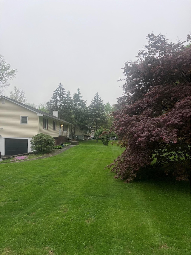 184 Cedar Valley Rd, Poughkeepsie, NY 12603 - view of grassy yard with an attached garage