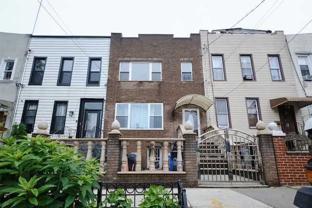 284 Hemlock St, Brooklyn, NY 11208 - view of property featuring brick siding and a gate