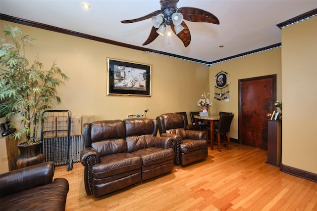 284 Hemlock St, Brooklyn, NY 11208 - living area featuring ceiling fan, light wood finished floors, baseboards, and crown molding
