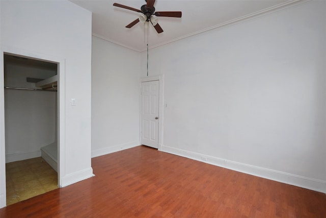 284 Hemlock St, Brooklyn, NY 11208 - unfurnished bedroom featuring baseboards, wood finished floors, a closet, ornamental molding, and ceiling fan