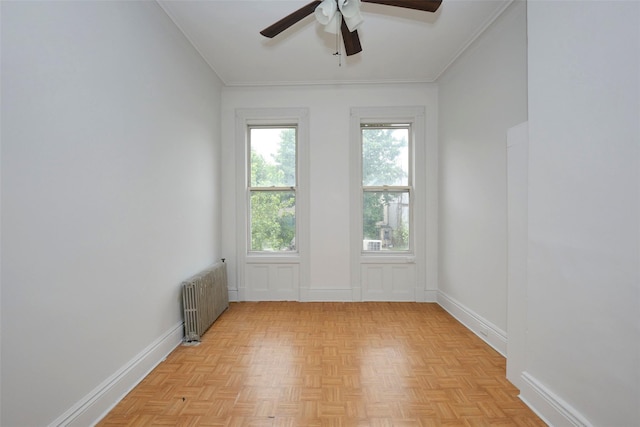 284 Hemlock St, Brooklyn, NY 11208 - unfurnished room with radiator heating unit, a ceiling fan, and baseboards