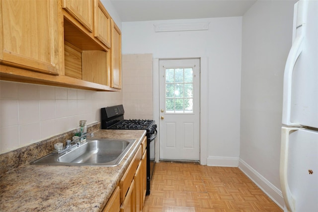 284 Hemlock St, Brooklyn, NY 11208 - kitchen with freestanding refrigerator, black gas range, a sink, decorative backsplash, and light brown cabinetry