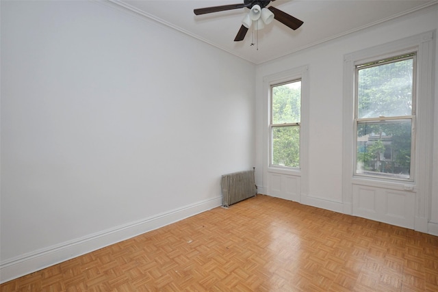 284 Hemlock St, Brooklyn, NY 11208 - spare room with radiator heating unit, ornamental molding, ceiling fan, and baseboards