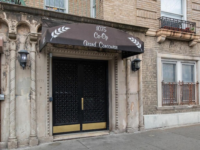 1075 Grand Concourse Unit 1N, Bronx, NY 10452 - view of exterior entry featuring brick siding