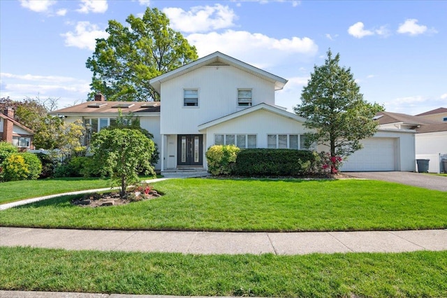 862 Fanwood Ave, North Woodmere, NY 11581 - view of front facade with a front lawn, an attached garage, and driveway
