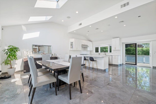 862 Fanwood Ave, North Woodmere, NY 11581 - dining room featuring light marble finish floors, a skylight, recessed lighting, and high vaulted ceiling