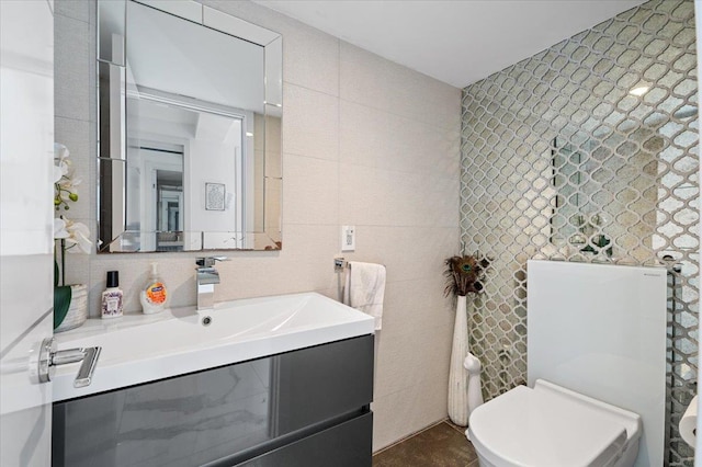 862 Fanwood Ave, North Woodmere, NY 11581 - bathroom featuring tile walls, toilet, and vanity