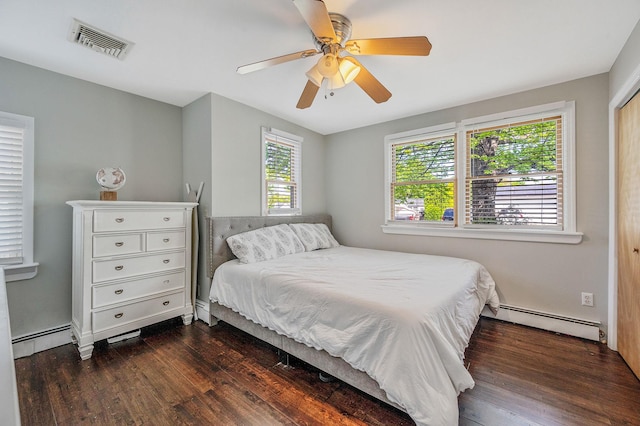 bedroom featuring a baseboard radiator, dark wood-type flooring, and a ceiling fan