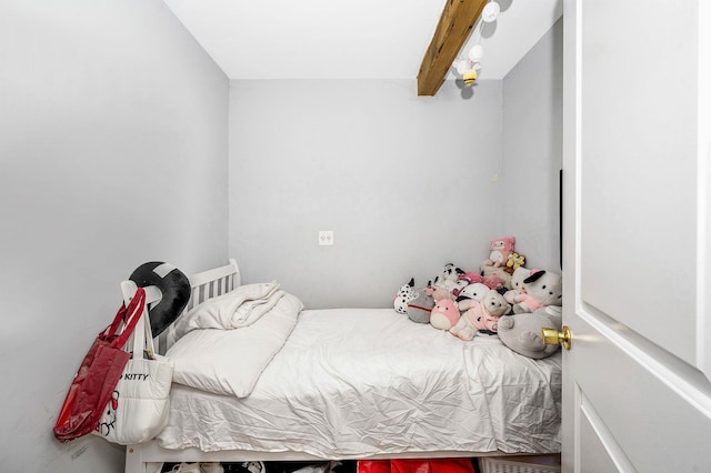 bedroom with beam ceiling