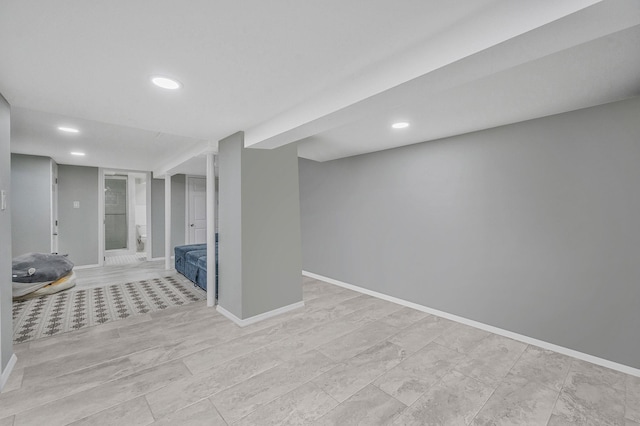 finished basement with recessed lighting and baseboards