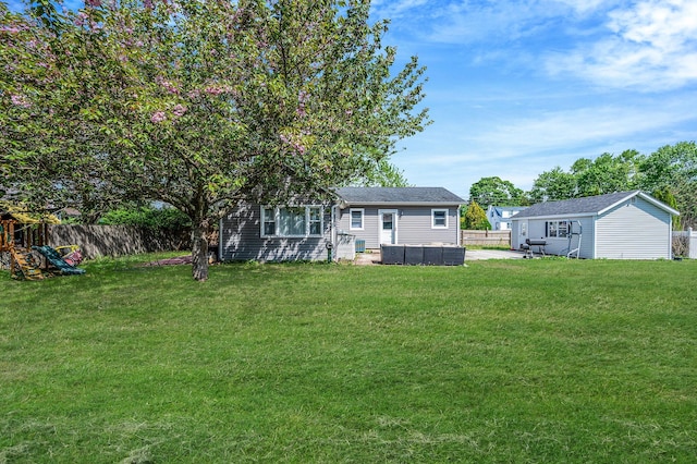 view of yard featuring an outdoor structure and a patio area