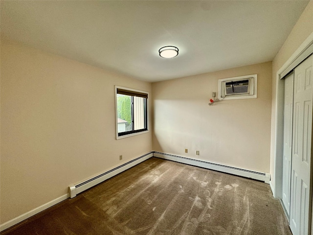 8 Ebury, Middletown, NY 10940 - empty room with a baseboard heating unit, a wall mounted air conditioner, baseboards, and carpet floors