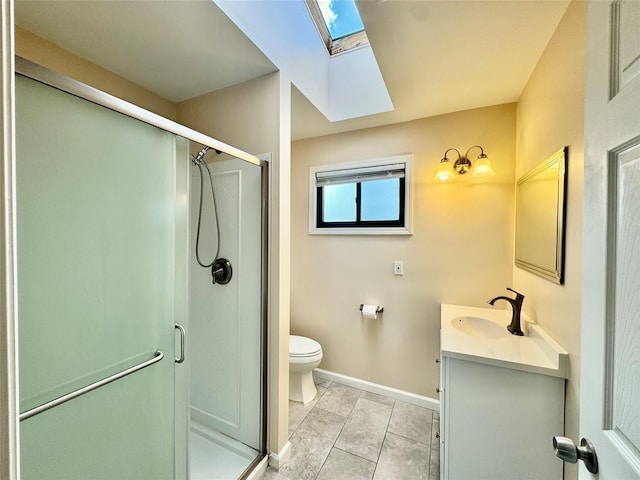 8 Ebury, Middletown, NY 10940 - bathroom featuring a skylight, toilet, a stall shower, baseboards, and vanity