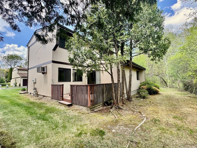 8 Ebury, Middletown, NY 10940 - rear view of house featuring a lawn, a wooden deck, and a wall unit AC