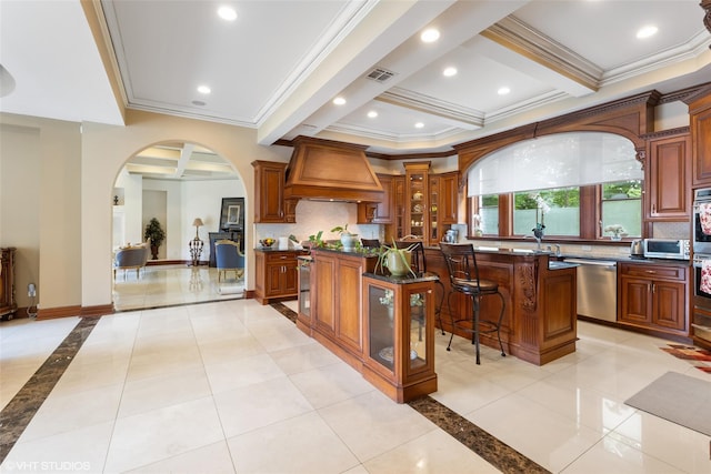 652 Haverstraw Rd, Suffern, NY 10901 - kitchen with a center island, stainless steel appliances, arched walkways, crown molding, and premium range hood