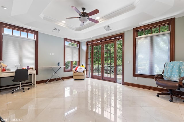 office space featuring a raised ceiling, plenty of natural light, baseboards, recessed lighting, and ornamental molding