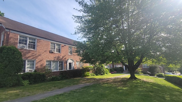 109 N Broadway Unit M12, White Plains, NY 10603 - view of front of house featuring brick siding and a front lawn