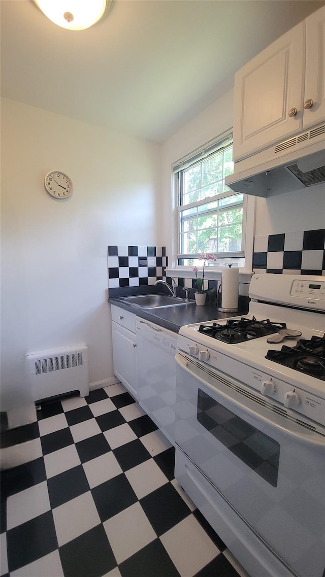 109 N Broadway Unit M12, White Plains, NY 10603 - kitchen with white appliances, radiator, under cabinet range hood, light flooring, and white cabinetry