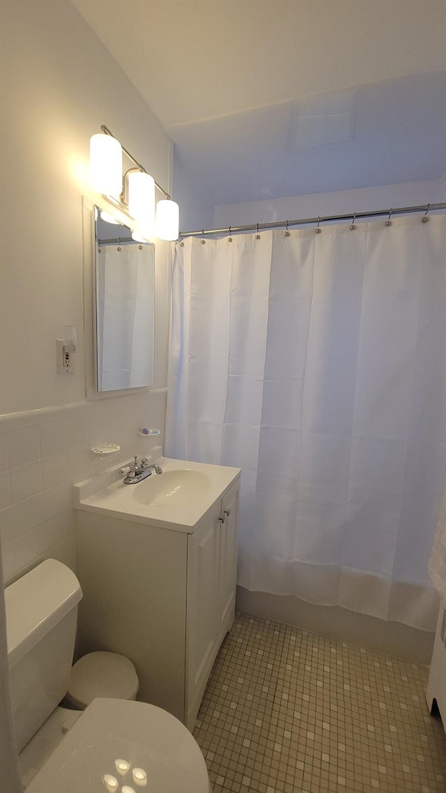 109 N Broadway Unit M12, White Plains, NY 10603 - bathroom featuring toilet, vanity, and tile patterned flooring