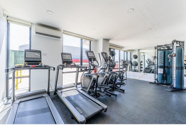 8808 Justice Ave Unit 16H, Elmhurst, NY 11373 - exercise room with a wall unit AC
