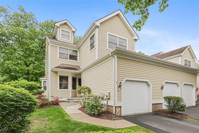 701 Pheasant Woods Rd, Briarcliff Manor, NY 10510 - view of front of house featuring asphalt driveway and a garage