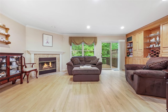 701 Pheasant Woods Rd, Briarcliff Manor, NY 10510 - living room featuring ornamental molding, light wood-style floors, a fireplace, and recessed lighting