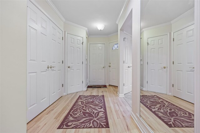 701 Pheasant Woods Rd, Briarcliff Manor, NY 10510 - foyer entrance featuring light wood-type flooring and crown molding