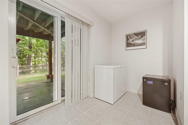 701 Pheasant Woods Rd, Briarcliff Manor, NY 10510 - doorway to outside featuring light tile patterned floors and baseboards