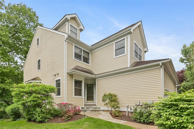 701 Pheasant Woods Rd, Briarcliff Manor, NY 10510 - rear view of property featuring entry steps and a yard