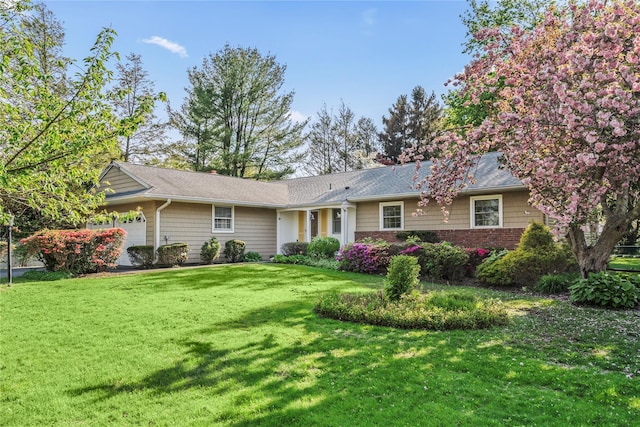 359 Old Bridge Rd, East Northport, NY 11731 - ranch-style house featuring a garage and a front lawn