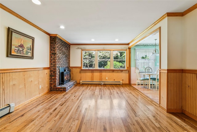 359 Old Bridge Rd, East Northport, NY 11731 - unfurnished living room featuring baseboard heating, a wainscoted wall, hardwood / wood-style flooring, ornamental molding, and recessed lighting