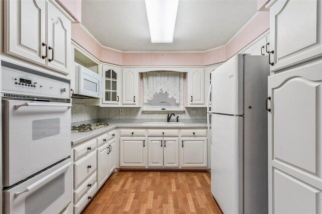 359 Old Bridge Rd, East Northport, NY 11731 - kitchen featuring white appliances, a sink, light countertops, and white cabinets