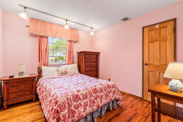 359 Old Bridge Rd, East Northport, NY 11731 - bedroom with track lighting and light wood-type flooring