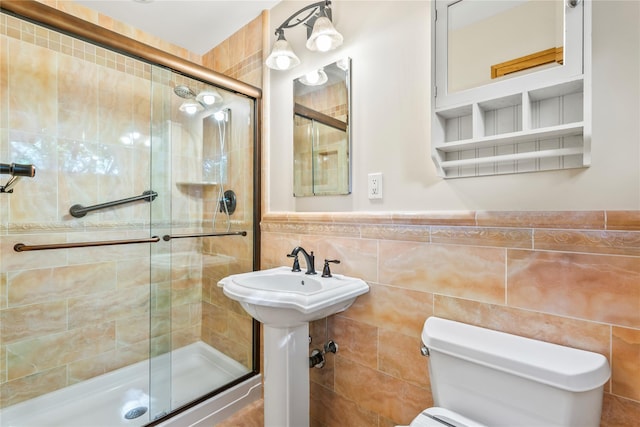 359 Old Bridge Rd, East Northport, NY 11731 - bathroom with a stall shower, tile walls, toilet, and wainscoting