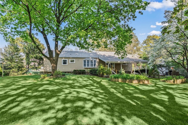 359 Old Bridge Rd, East Northport, NY 11731 - back of house with a lawn