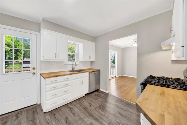 105 Colgate Ave, Yonkers, NY 10703 - kitchen featuring butcher block countertops, stainless steel appliances, a sink, wood finished floors, and white cabinetry