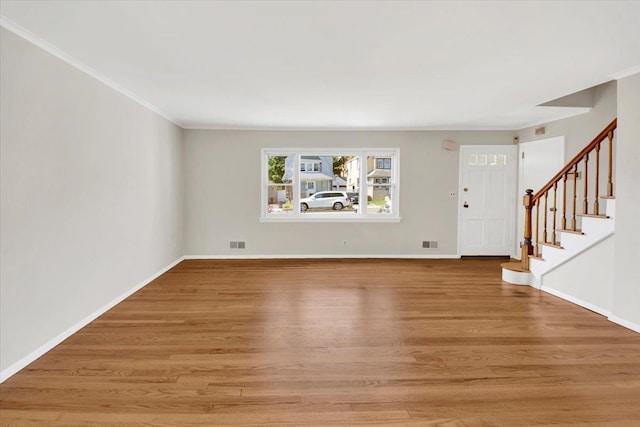 105 Colgate Ave, Yonkers, NY 10703 - unfurnished living room with light wood-style floors, stairway, ornamental molding, and baseboards
