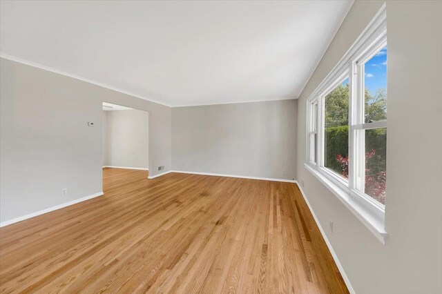 105 Colgate Ave, Yonkers, NY 10703 - unfurnished room with light wood finished floors, baseboards, and crown molding