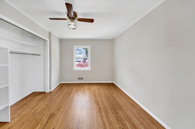 105 Colgate Ave, Yonkers, NY 10703 - unfurnished bedroom featuring wood finished floors, a closet, ornamental molding, baseboards, and a ceiling fan