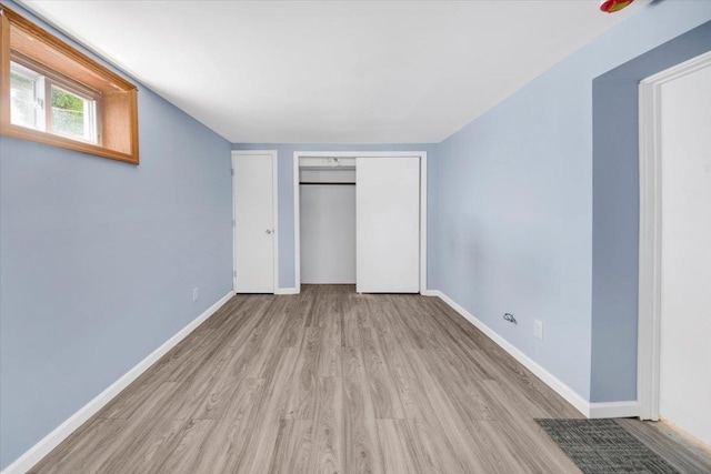 105 Colgate Ave, Yonkers, NY 10703 - unfurnished bedroom with wood finished floors and baseboards