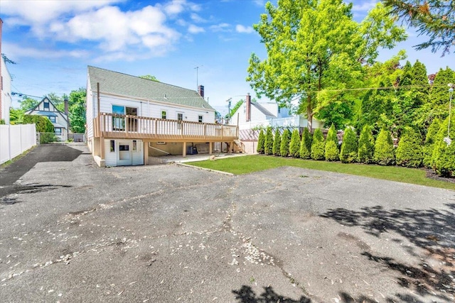 105 Colgate Ave, Yonkers, NY 10703 - rear view of property with a wooden deck and fence