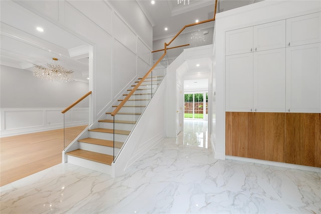 46 Snapdragon Ln, Roslyn Heights, NY 11577 - staircase featuring a decorative wall, marble finish floors, ornamental molding, and recessed lighting