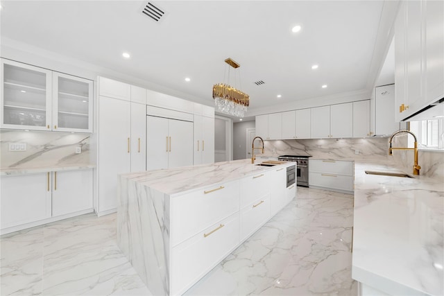 46 Snapdragon Ln, Roslyn Heights, NY 11577 - kitchen featuring a sink, tasteful backsplash, light marble finish floors, and recessed lighting