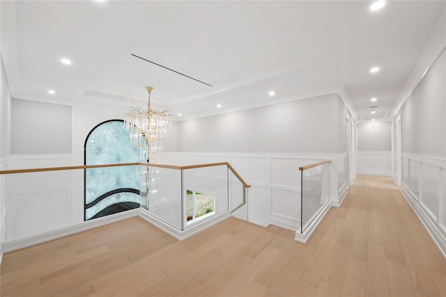 46 Snapdragon Ln, Roslyn Heights, NY 11577 - hallway with an upstairs landing, a decorative wall, light wood-style floors, a chandelier, and recessed lighting